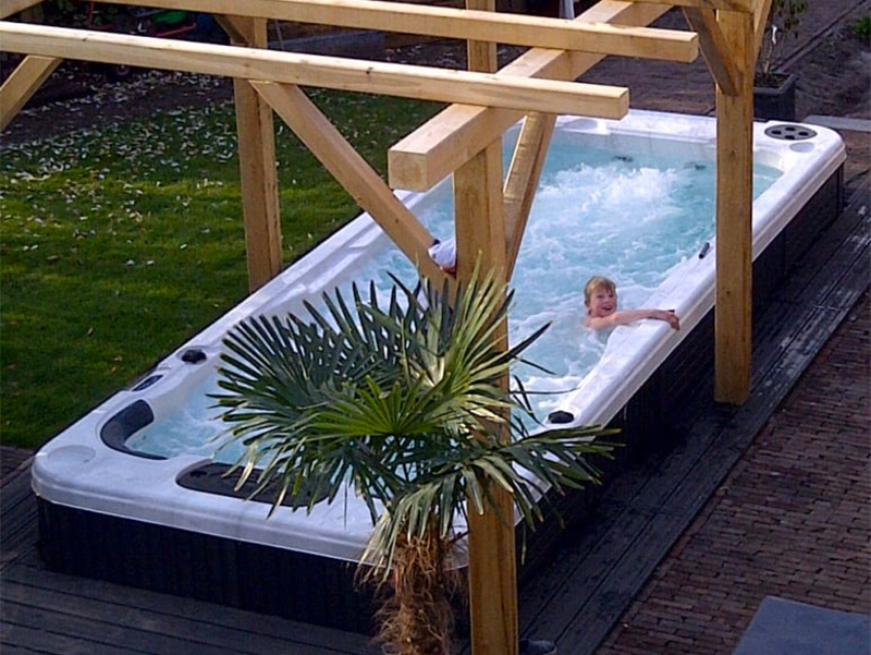 boy in swim spa having fun