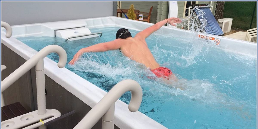 man swimming work out in a swim spa