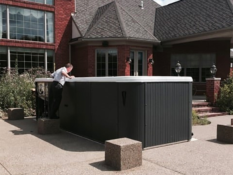 Maintenance man looking into denver swim spa