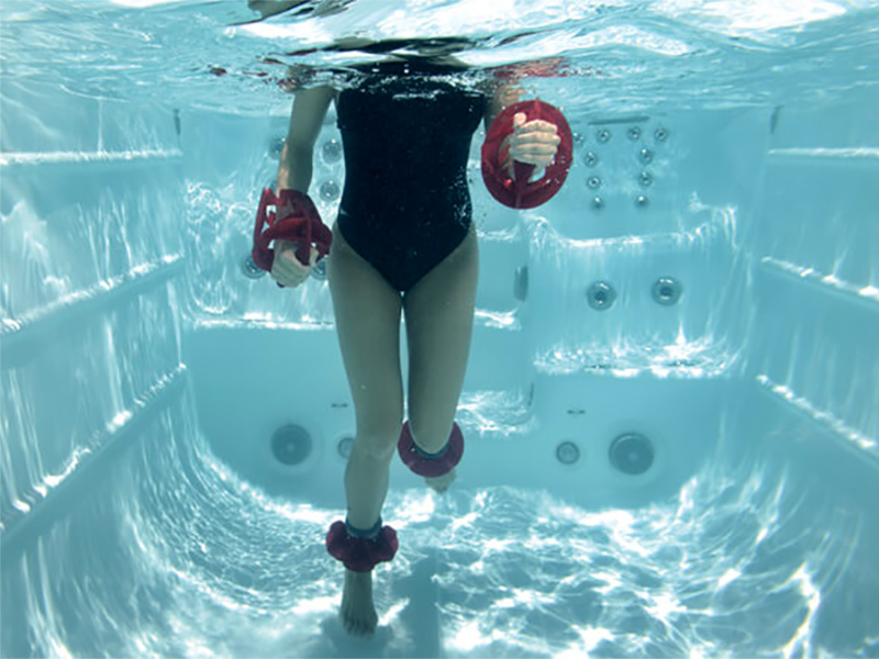 Girl running in place in a swim spa