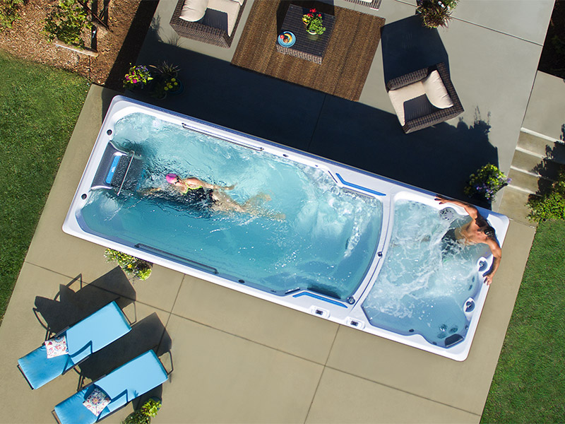 Lady using currents to swim in a swim spa in Denver